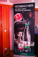 <p>Ein Rosbacher-Werbeplakat mit dem Schriftzug "Mit dem 2:1-Ideal für Gäste mit Anspruch" im Saal der Frankfurter Sportgala</p>